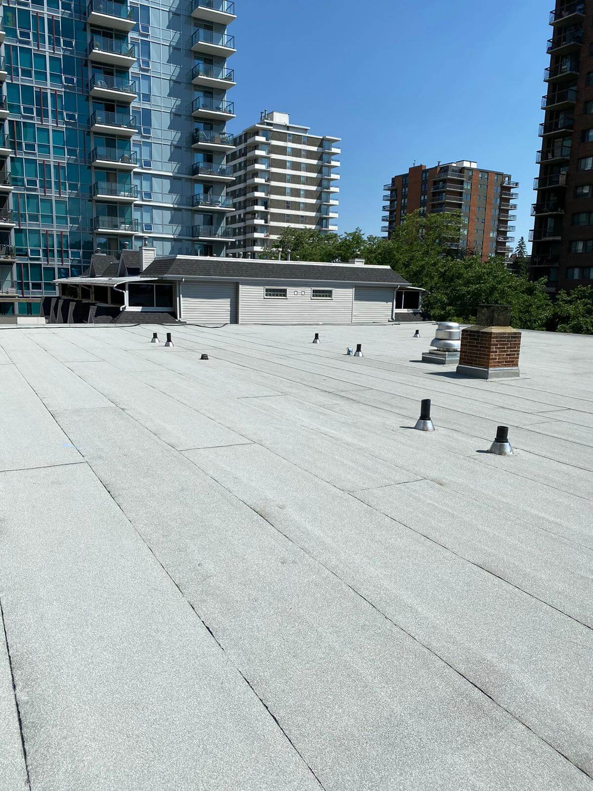 Commercial_Roofing_Preventative Commercial flat roof inspection and preventative maintenance being performed in Calgary
